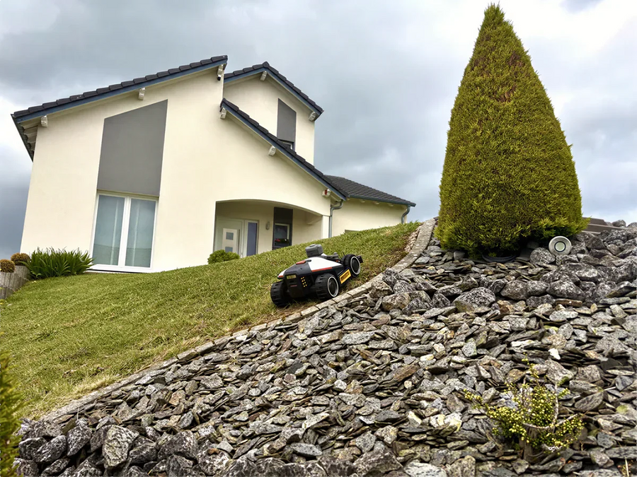 MAMMOTION robotic mower maintaining a family lawn