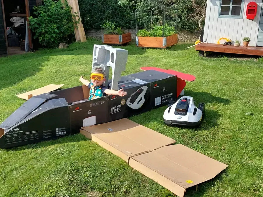 MAMMOTION robotic mower crossing a landscaped lawn