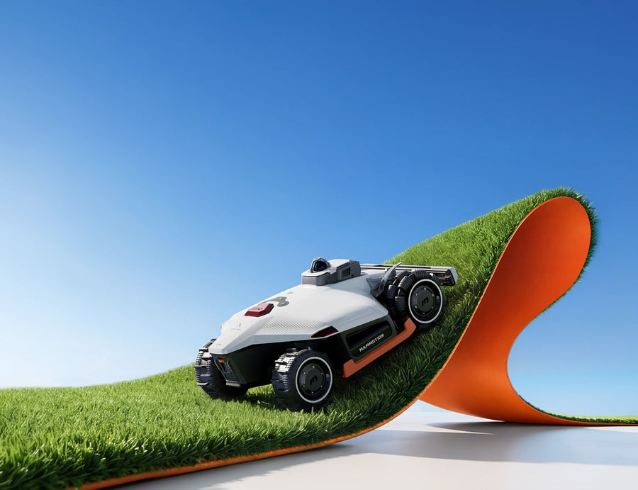 MAMMOTION robotic mowers crossing a grassy racing landscape